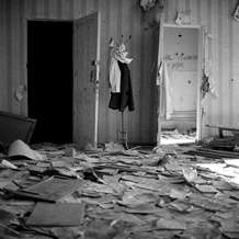 A dove was attached to a coat stand in the ruins of School No. 1, Beslan, North Ossetia, September 2004